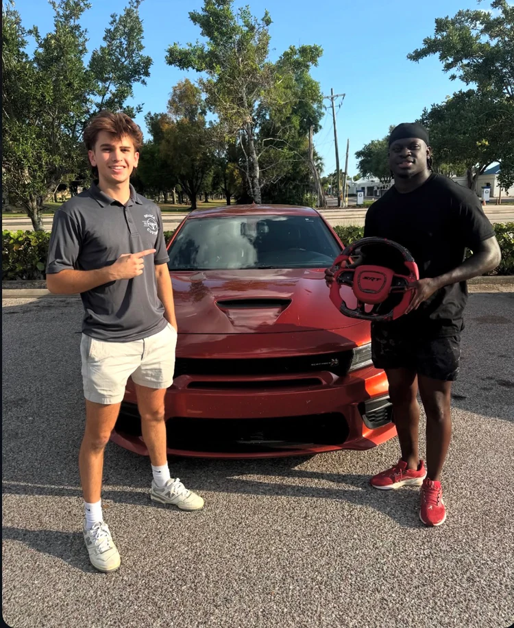 Customers with a red carbon SRT wheel and a Dodge Charger